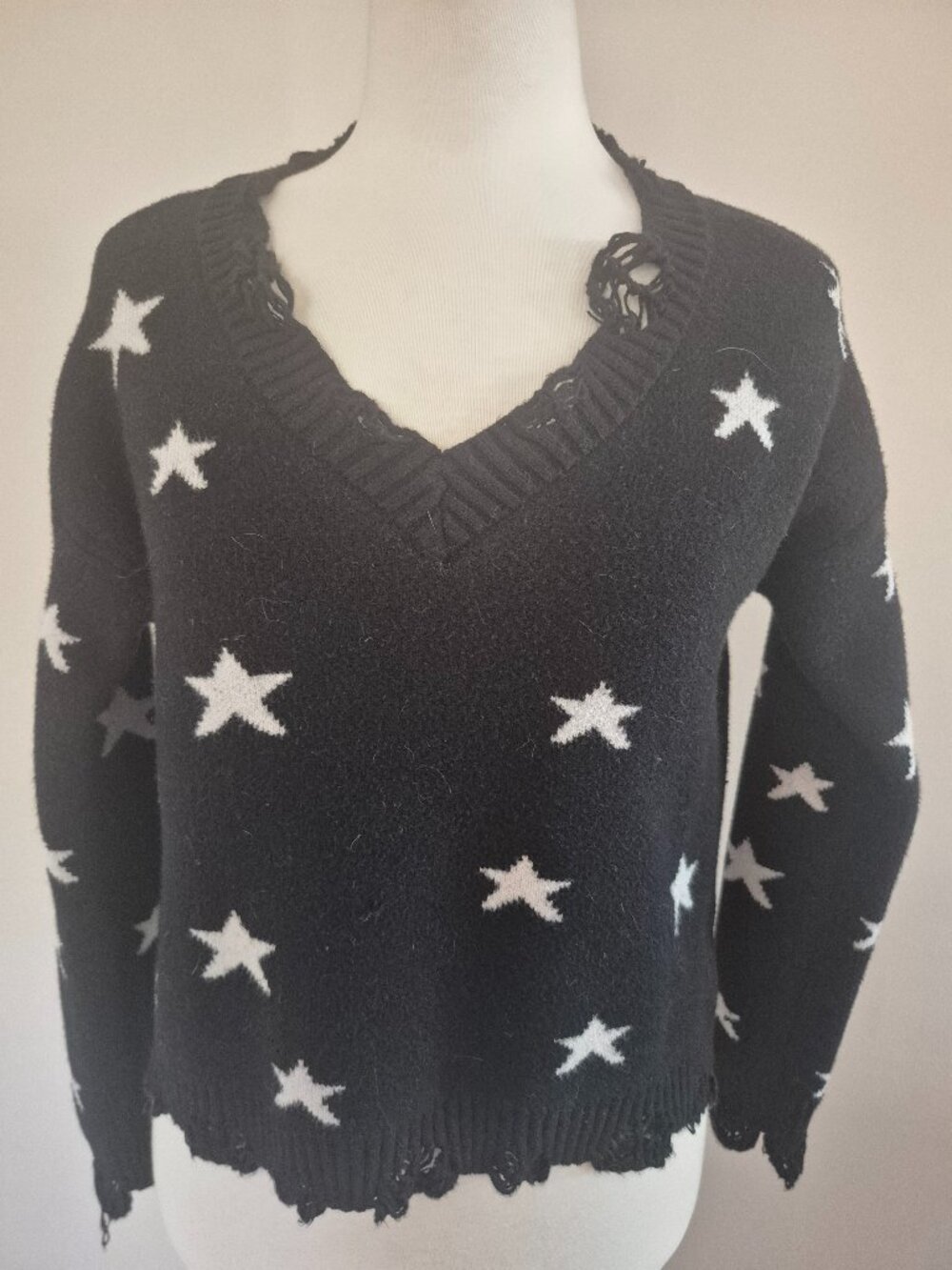 Black knitted Sweater. Star Printed. Med/Large